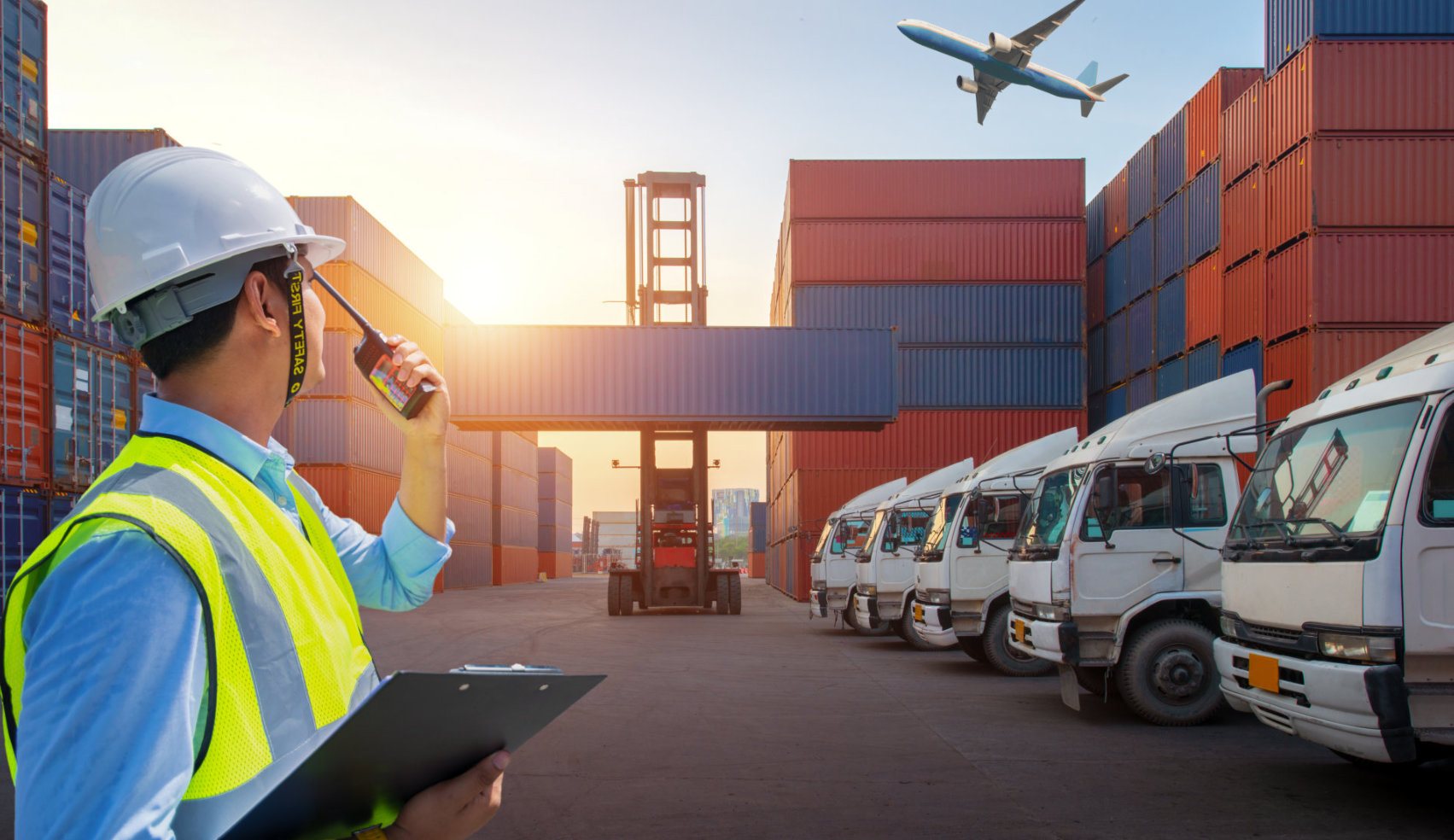 man using a radio at the port